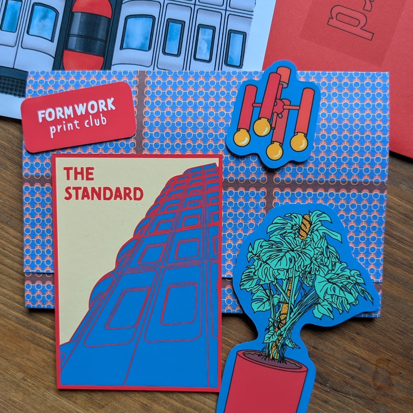 Colorful die-cut paper art pieces on a wooden surface, formwork print club, the standard hotel, london